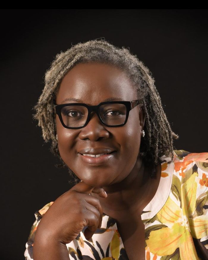 Projects Director Victoria Ojoo in glasses and a floral top