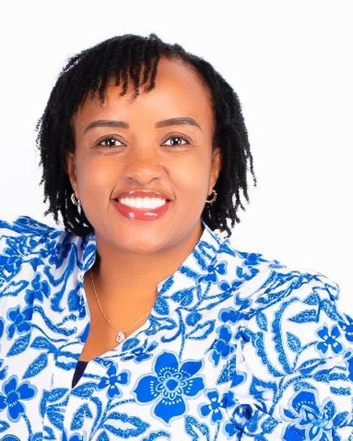 New Generation Director Catherine Muli in a blue and white patterned top