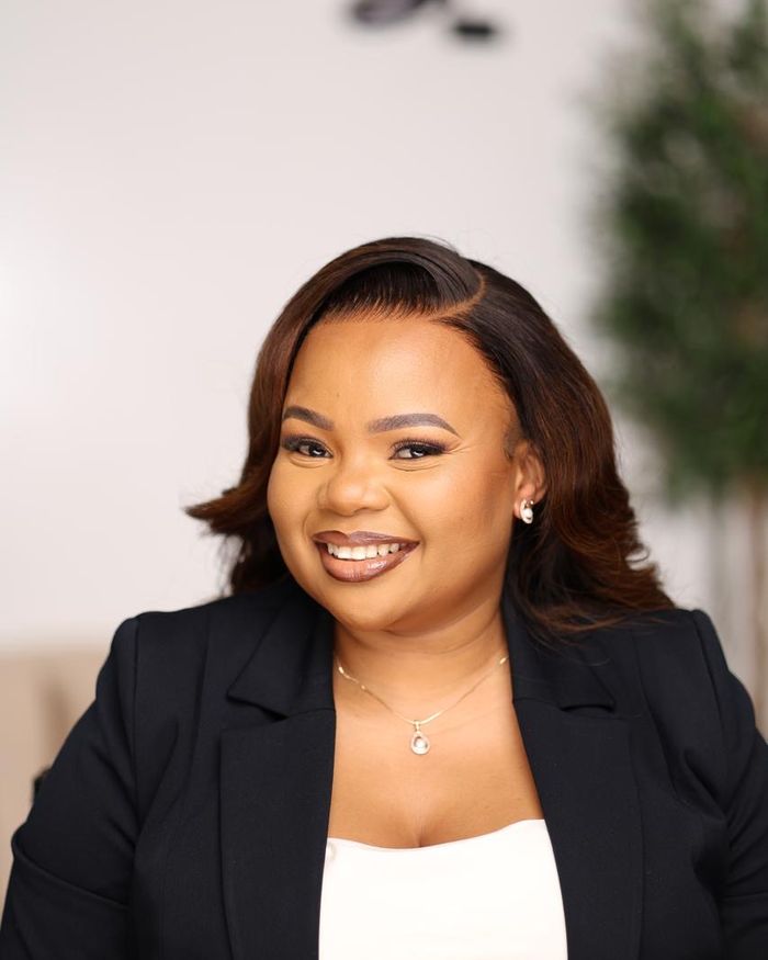 Public Relations Director Miriam Murage in a dark blazer